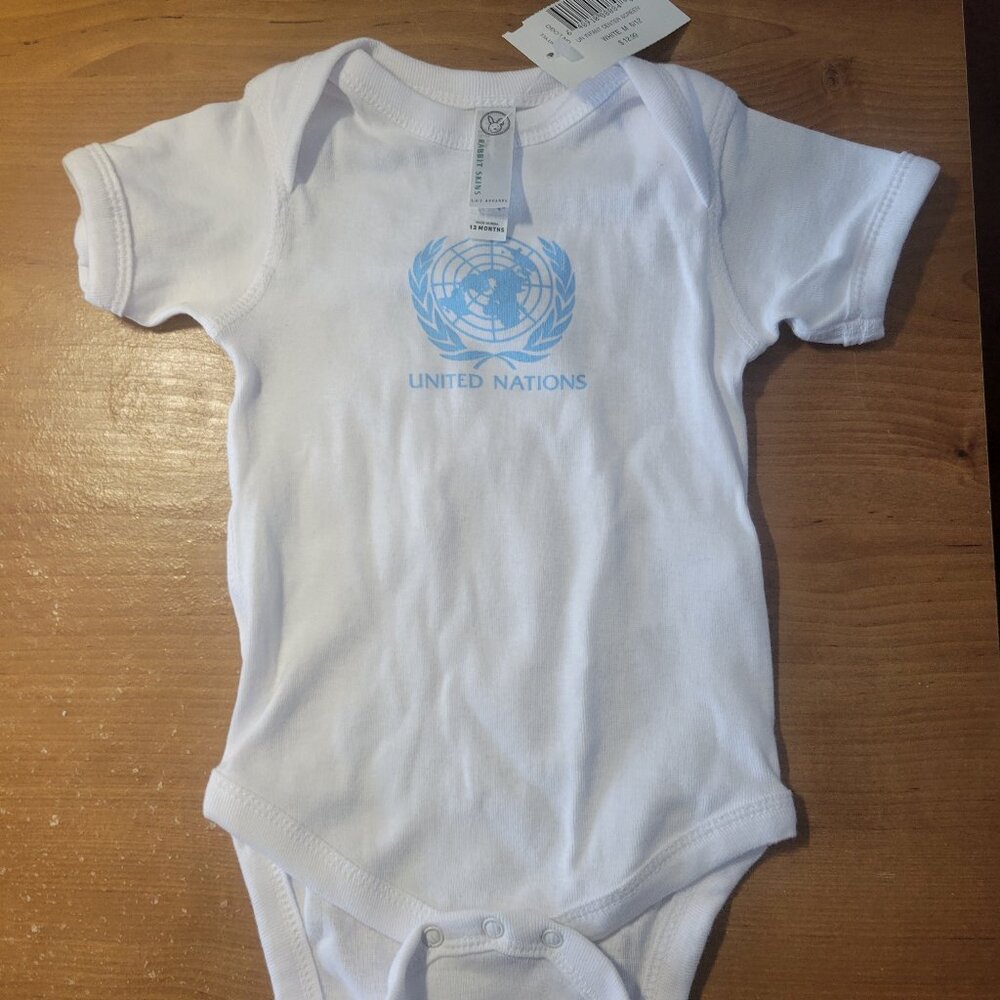 United Nations Onezie with a Stuffed Bear